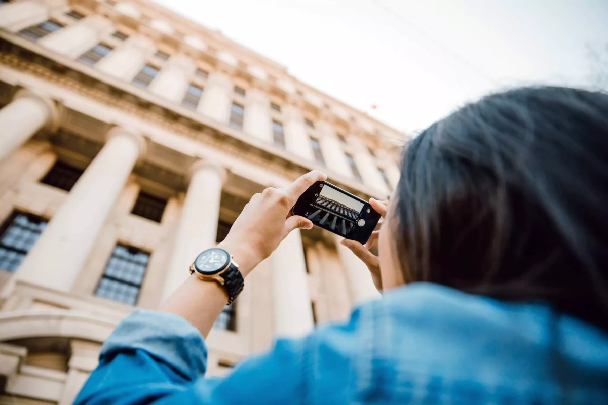 Xpress Print Tourist taking photo of a building