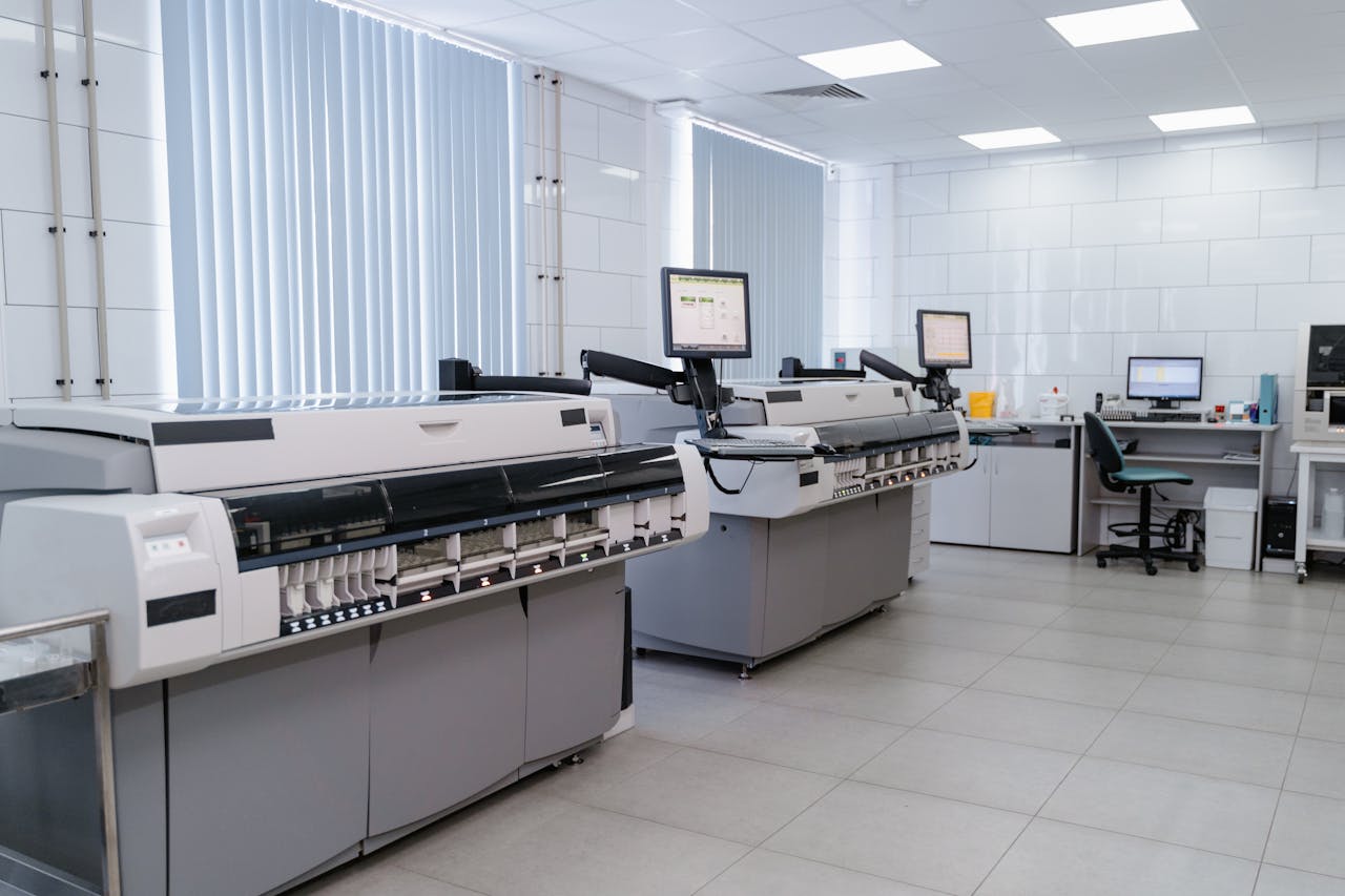 Mastering the First Impression: Your intriguing post title goes here Spacious modern laboratory featuring advanced printing equipment and workstations.
